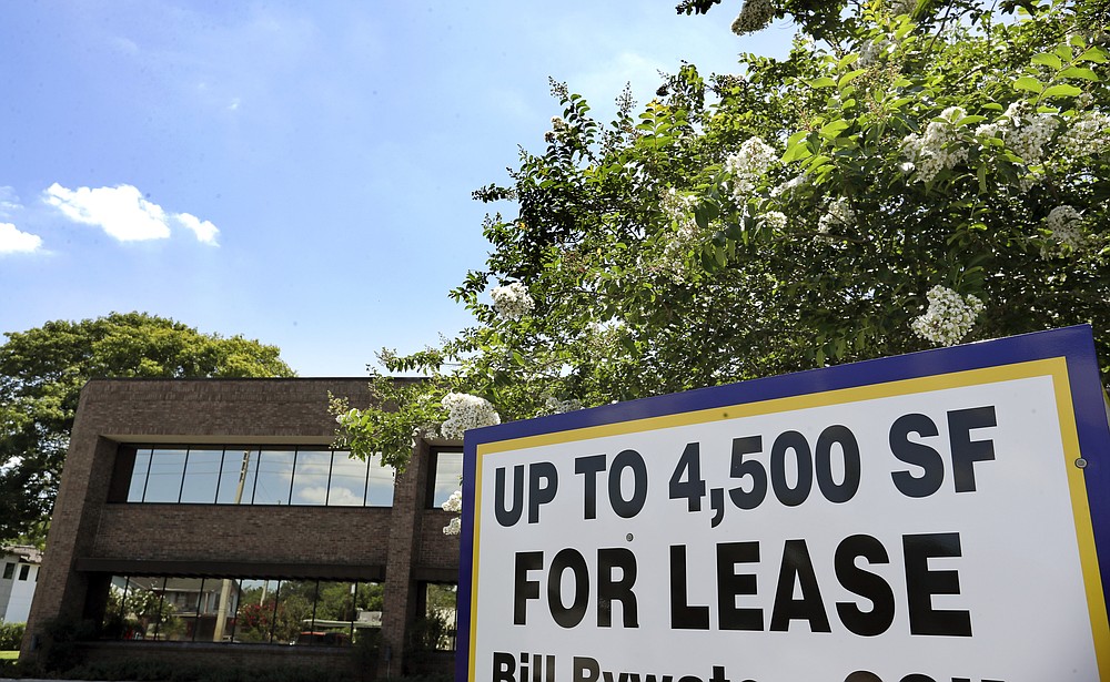 This Monday, June 22, 2020 photo shows a commercial real estate property for lease, in Orlando, Fla. Many businesses devastated by the coronavirus pandemic are expected to abandon offices and storefronts. The changes are happening because more employees are working from home, and more people are shopping online.(AP Photo/John Raoux)