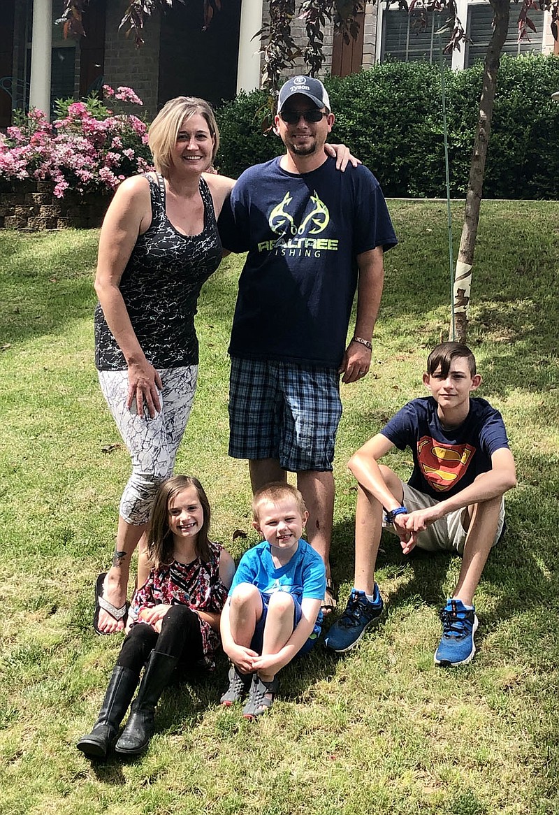 Photo submitted
The Hoskins family gathers on their front lawn for a photo op to celebrate the hard work put in on their yard which earned them June's Yard of the Month.