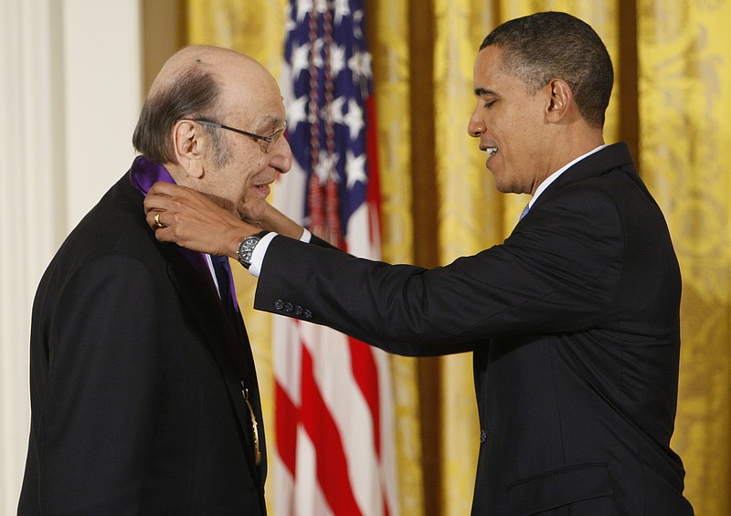 In this Thursday, Feb. 25, 2010, file photo, President Barack Obama presents a 2009 National Medal of Arts to Milton Glaser, in the East Room of the White House in Washington. Glaser, the designer who created the “I (HEART) NY” logo and the famous Bob Dylan poster with psychedelic hair, died Friday on his 91st birthday. - AP Photo/Charles Dharapak