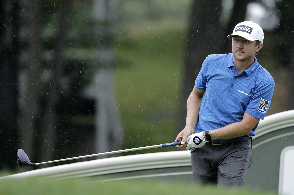 Mackenzie Hughes, of Canada, watches his tee shot on the 18th hole during the third round of the Travelers Championship golf tournament at TPC River Highlands, Saturday, June 27, 2020, in Cromwell, Conn. (AP Photo/Frank Franklin II)