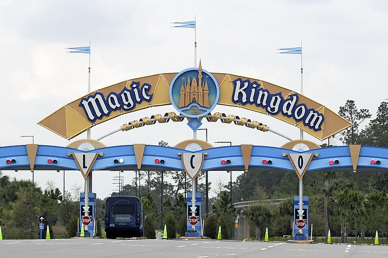 The entrance to the parking lot at the Magic Kingdom at Walt Disney World is closed on March 16 in Lake Buena Vista, Fla. The National Basketball Association will be resuming its season on July 30 at Disney's ESPN Wide World of Sports complex with the 22 teams chosen to continue staying at the resort. - Photo by John Raoux of The Associated Press story.lead_photo.caption