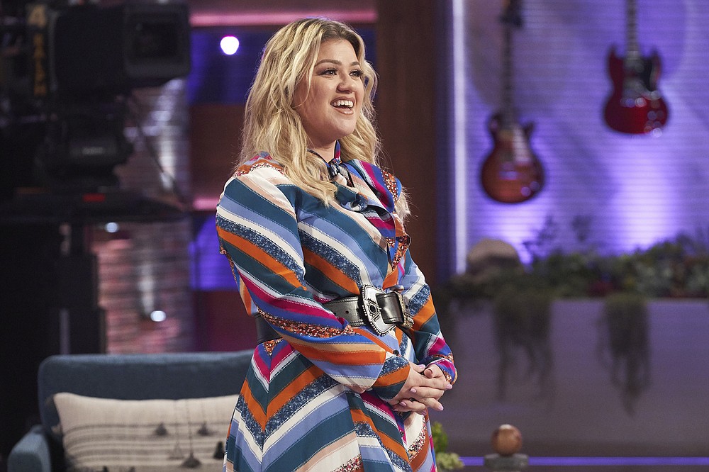 This image released by NBC shows Kelly Clarkson on the set of her syndicated talk show "The Kelly Clarkson Show." Clarkson won an Emmy for outstanding entertainment talk show host for "The Kelly Clarkson Show" at the 47th annual Daytime Emmy Awards. (Adam Christopher/NBCUniversal via AP)