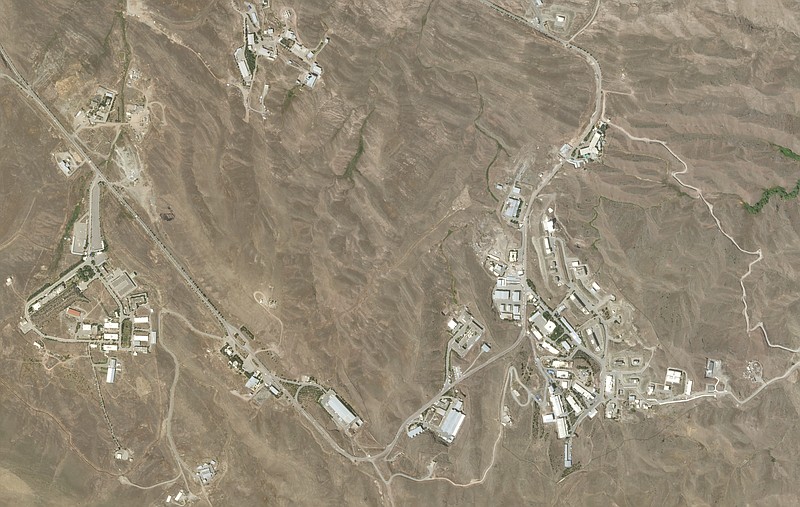 This June 10, 2020, satellite image from Planet Labs shows the site of a June 26, 2020 explosion that rattled Iran's capital before the blast. Analysts say the blast came from an area in Tehran's eastern mountains they hides a underground tunnel system and missile production sites. The explosion appears to have charred hundreds of meters of scrubland. (Planet Labs via AP)