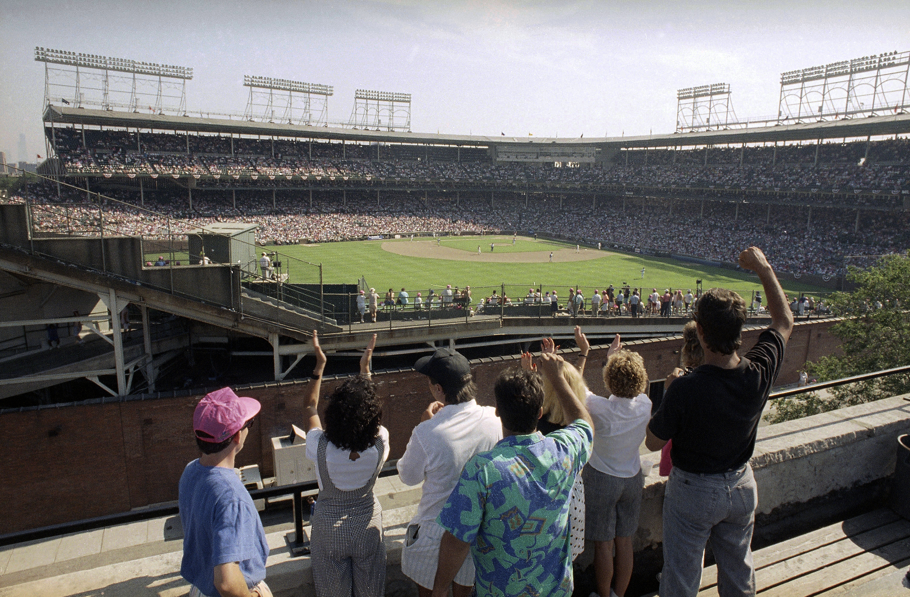 Socially distanced baseball fans watch a spring training