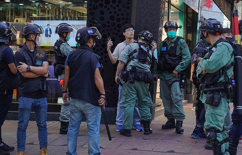 Police detain a person during a pro-democracy rally supporting human rights and to protest against Beijing's national security law in Hong Kong, Sunday, June 28, 2020. (AP Photo/Vincent Yu) story.lead_photo.caption