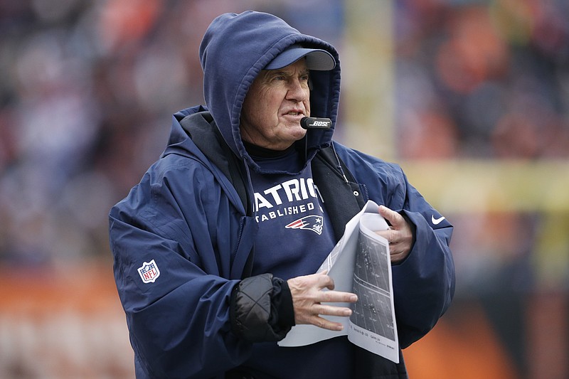 FILE - In this Dec. 15, 2019, file photo, New England Patriots coach Bill Belichick stands on the sideline during the second half of the team's NFL football game against the Cincinnati Bengals in Cincinnati. The Patriots have been fined $1.1 million by the NFL for inappropriately filming the Cincinnati Bengals’ sideline during a game last season. On Sunday, June 28, 2020, the league also took away a third-round pick in the 2021 draft. “I personally have never viewed any video footage at all, anything that those production people have done, other than what’s shown on public television or something like that,” Belichick said in December. (AP Photo/Gary Landers, File)