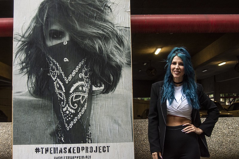 Facial expressions Artist uses downtown walls to document the times