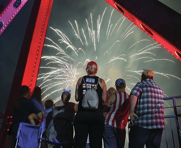 Spectators watch from the fireworks over the Arkansas River from Little Rock's Junction Bridge for the finale of the 2019 Pops on the River. This year's event has been canceled.
(Democrat-Gazette file photo/Thomas Metthe)