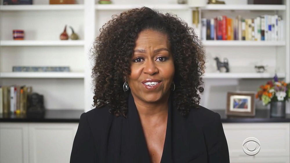 In this video grab issued Sunday, June 28, 2020, by BET, former U.S. first lady Michelle Obama introduces humanitarian award winner Beyonce during the BET Awards. (BET via AP)