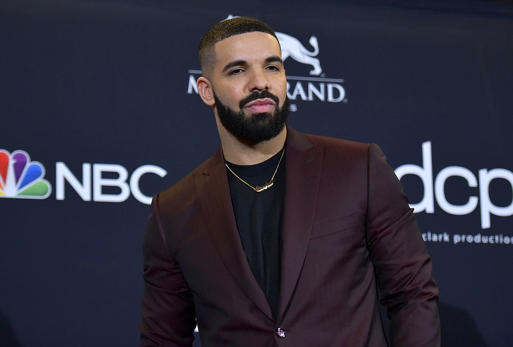 FILE - This May 1, 2019 file photo shows Drake at the Billboard Music Awards in Las Vegas. Drake is the leading nominee at the 2020 BET Awards, which will celebrate its 20th anniversary later this month. BET announced Monday that Drake is nominated for six honors, including video of the year and best male hip-hop artist. For both best collaboration and the viewer's choice award, Drake is nominated twice thanks to the hits "No Guidance" with Chris Brown and "Life Is Good" with Future. (Photo by Richard Shotwell/Invision/AP, File)