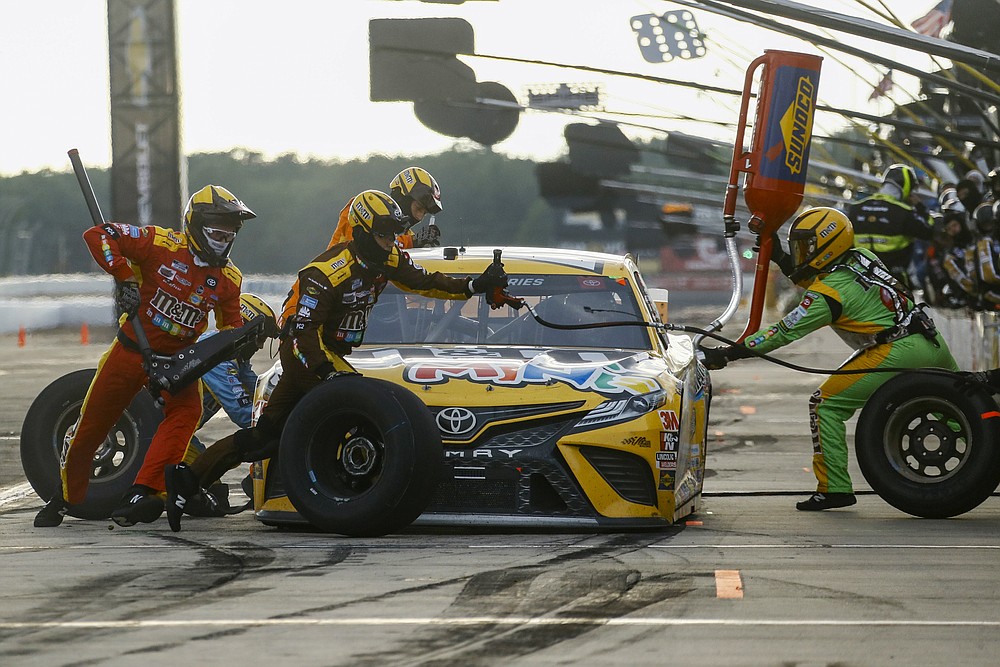 Kyle Busch makes a pit stop during the NASCAR Cup Series auto race at Pocono Raceway, Sunday, June 28, 2020, in Long Pond, Pa. (AP Photo/Matt Slocum)