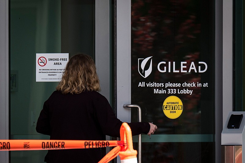 A person enters a building at Gilead Sciences headquarters in Foster City, Calif., on March 19, 2020. MUST CREDIT: Bloomberg photo by David Paul Morris