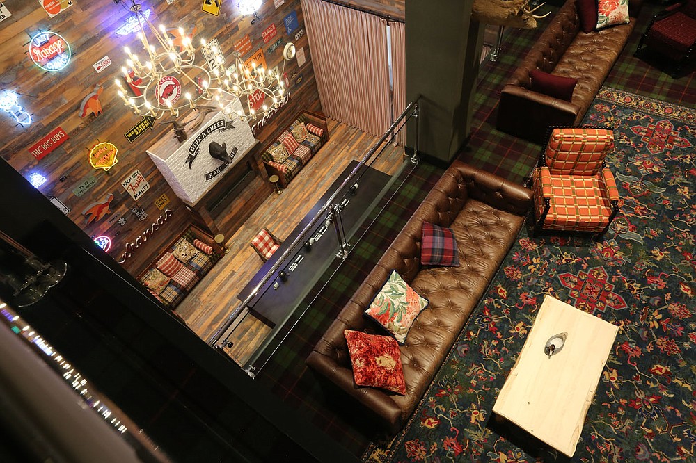 A view of a section of the lobby area riday, June 26, 2020, in the Graduate Fayetteville hotel in Fayetteville. Hotel, motel and restaurant sales tax collections fell significantly across the region in March and April when the pandemic prompted business closures across the state. Graduate Fayetteville reopened its doors to guests on Thursday. Check out nwaonline.com/200628Daily/ and nwadg.com/photos for a photo gallery.
(NWA Democrat-Gazette/David Gottschalk)