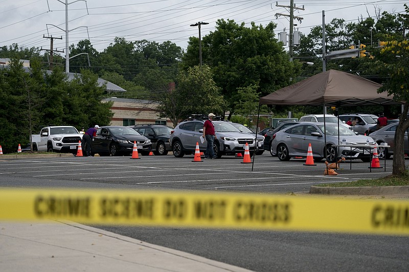 Vehicles sit in line at a drive-thru coronavirus testing site in Arlington, Virginia, on Friday, June 19, 2020. MUST CREDIT: Bloomberg photo by Andrew Harrer.