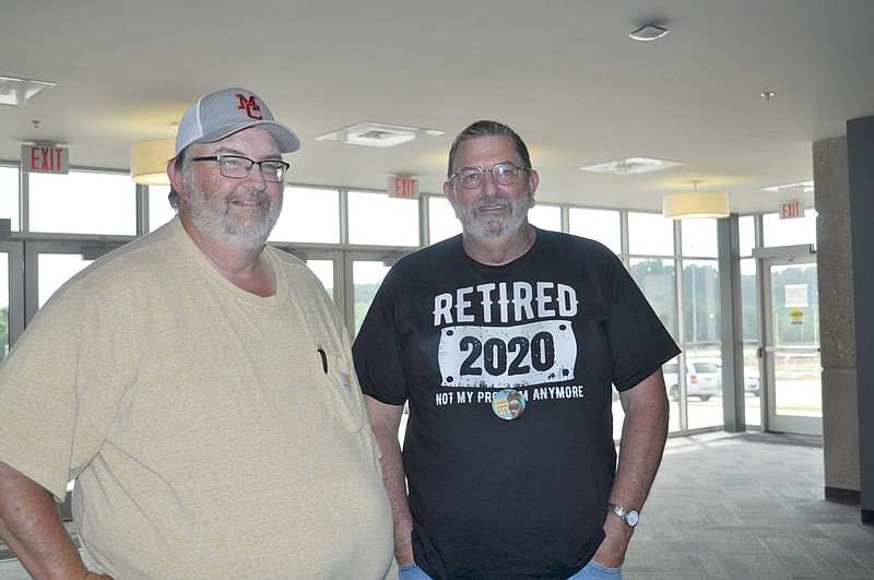 RACHEL DICKERSON/MCDONALD COUNTY PRESS Bob Campbell, right, is pictured at his retirement reception at the McDonald County High School Performing Arts Center with Kim Harrell, left, on June 30. Campbell retired after 40 years of working for the district as a teacher and director of facilities maintenance.