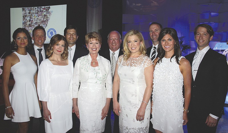 NWA Democrat-Gazette/CARIN SCHOPPMEYER Robin and Gary George (center) are joined by their family at the ACH benefit — Samantha and Charles George (from left), Mary Kathryn and Matt Brown, Julie and Patrick Swope and Anna and Carl George.