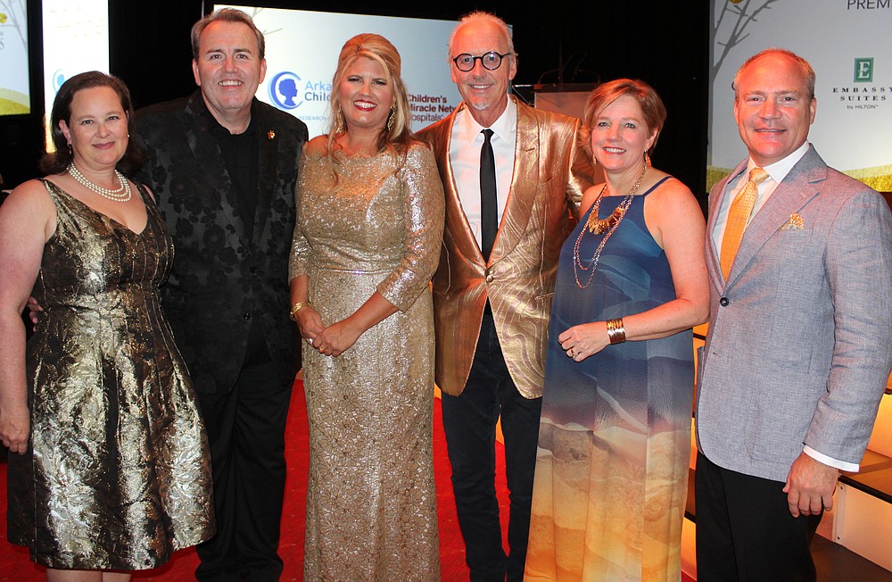 NWA Democrat-Gazette/CARIN SCHOPPMEYER
Mary and Fred Scarbrough, Arkansas Children's Foundation president; Mandy Macke, Color of Hope Gala chairwoman; Johnny Mike Walker, gala champion sponsor; and Marcy Doderer, Arkansas Children's president and CEO and husband Mark welcome guests to the 12th annual benefit for Arkansas Children's Northwest on Aug. 2 at the John Q. Hammons Center in Rogers.