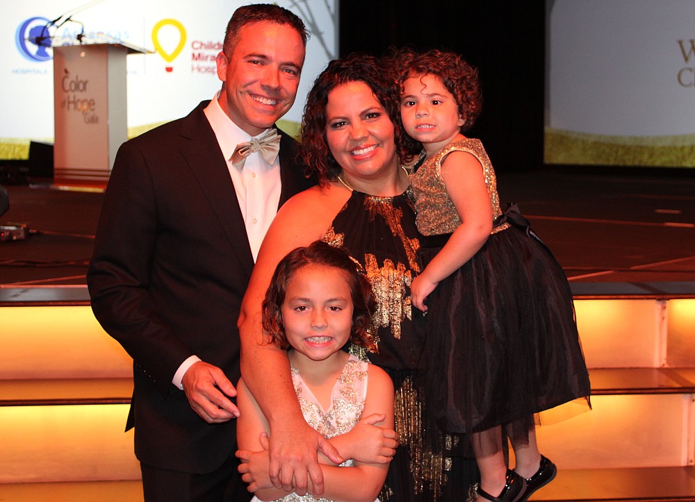 NWA Democrat-Gazette/CARIN SCHOPPMEYER Matt and Erin Johnson, with their daughters Sydney Johnson and Tori Johnson, Color of Hope Champion Child attend the benefit gala.