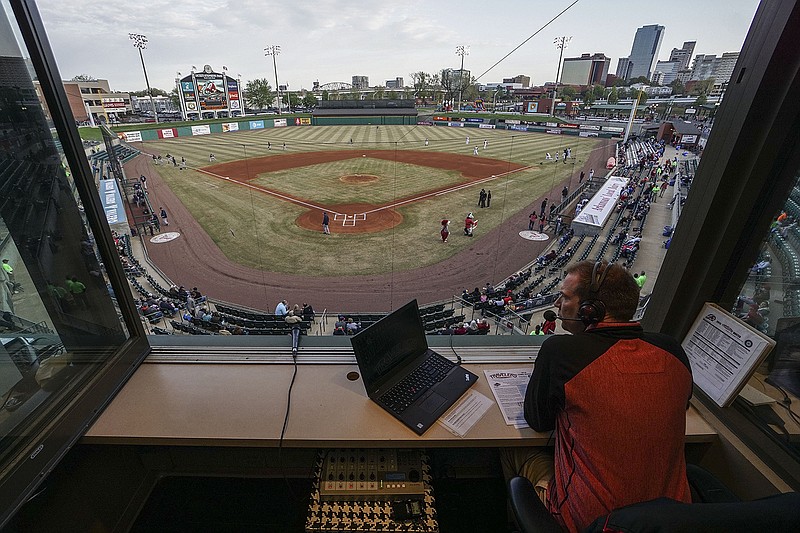 Arkansas Travelers radio broadcaster Steven Davis looks out over the field at Dickey-Stephens Park before the Travelers' April 5, 2018 season opener. Davis will not have the chance to do that this year after Tuesday's announcement that all minor-league baseball has been canceled because of the coronavirus pandemic. - Photo by Mitchell Pe Masilun of Arkansas Democrat-Gazette