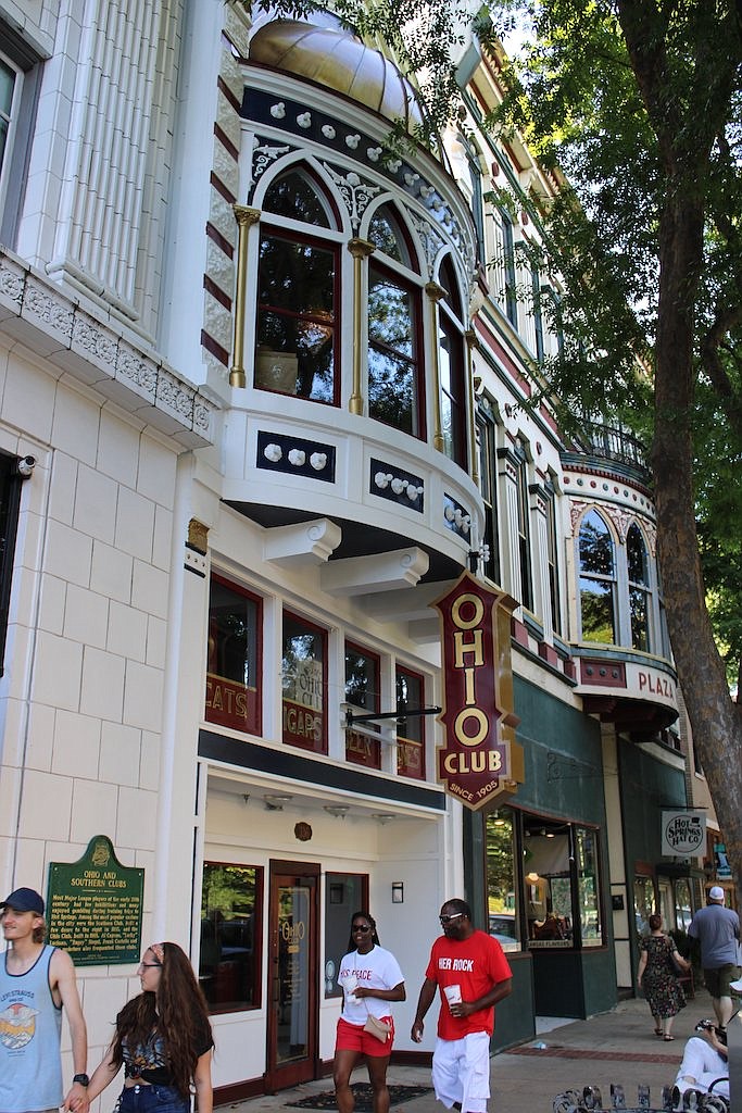 People walk past the Ohio Club on Saturday, June 6. - Photo by Tanner Newton of The Sentinel-Record