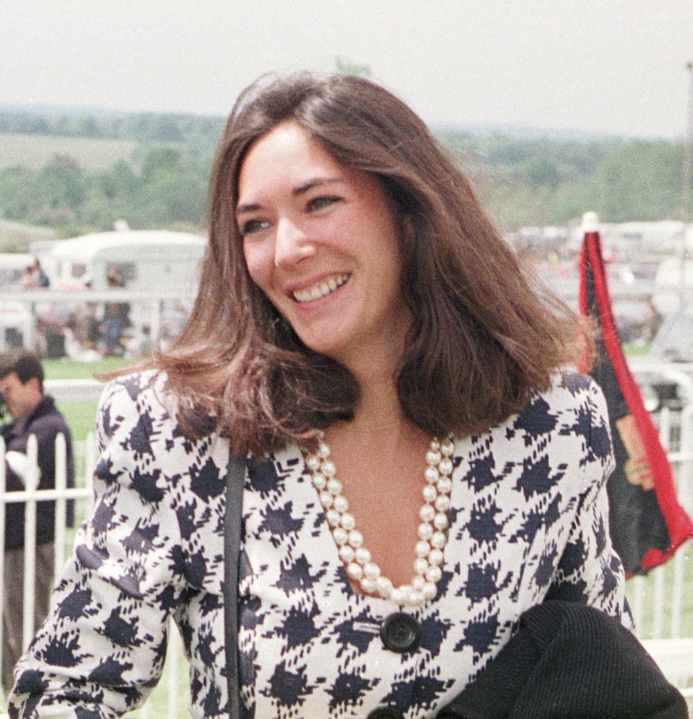 FILE - In this June 5, 1991 file photo, British socialite Ghislaine Maxwell arrives at Epsom Racecourse. The FBI said Thursday July 2, 2020, Ghislaine Maxwell, who was accused by many women of helping procure underage sex partners for Jeffrey Epstein, has been arrested in New Hampshire. (Chris Ison/PA via AP, File)