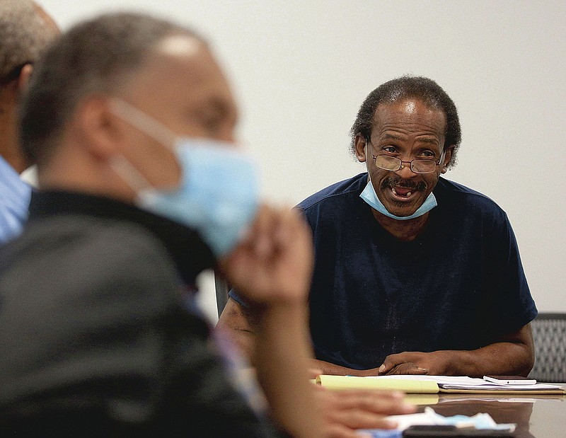 FILE - Kenyon Lowe, right, Metropolitan Housing Authority Commission chairman, calls for a vote, Thursday July 2, 2020, during a commission meeting in Little Rock. (Arkansas Democrat-Gazette/Staton Breidenthal)