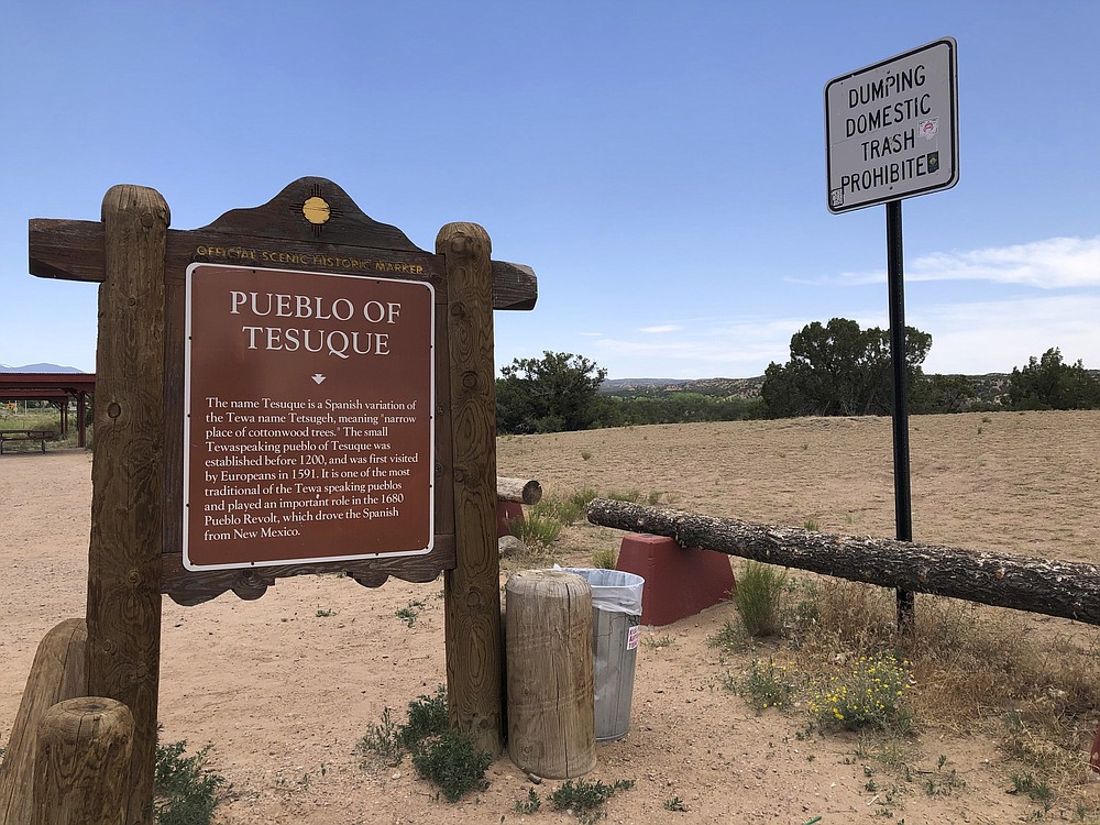 A sign marking the land of Tesuque Pueblo of New Mexico is shown on Tesuque Pueblo, on Thursday, June 25, 2020. The Native American tribe in northern New Mexico has opened up a movie studio at the site of a former casino aimed at attracting big productions in what is believed to be a first by a Indigenous tribal government in the U.S. (AP Photo/ Russell Contreras)