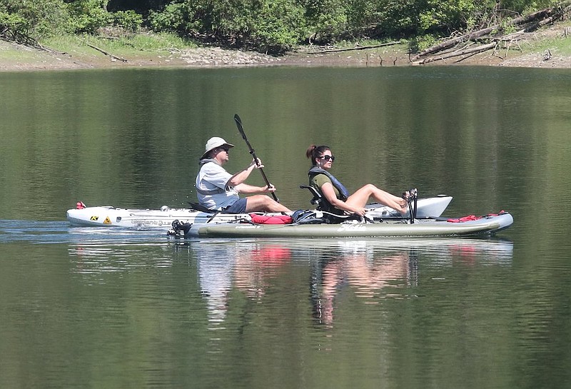 Kayakers paddle out into Lake Ouachita in August 2019. - File photo by The Sentinel-Record