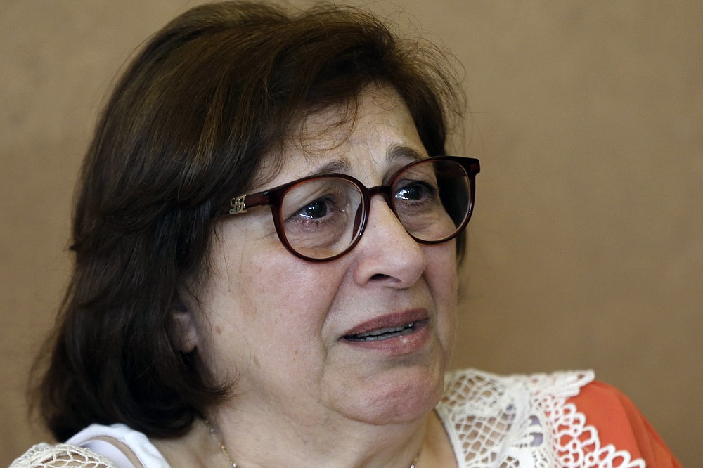 Laure Ghosn, whose husband Charbel Zogheib has been missing for the past 37 years, cries as she speaks during an interview at her home in Sarba, north of Beirut, Lebanon on June 26, 2020. Ghosn said her husband is held in Syria and hopes that a new wave of sanctions imposed by the U.S. against the Syrian government will force Damascus to reveal the fate of hundreds of Lebanese citizens held in Syria, including that of her husband. (AP Photo/Bilal Hussein)