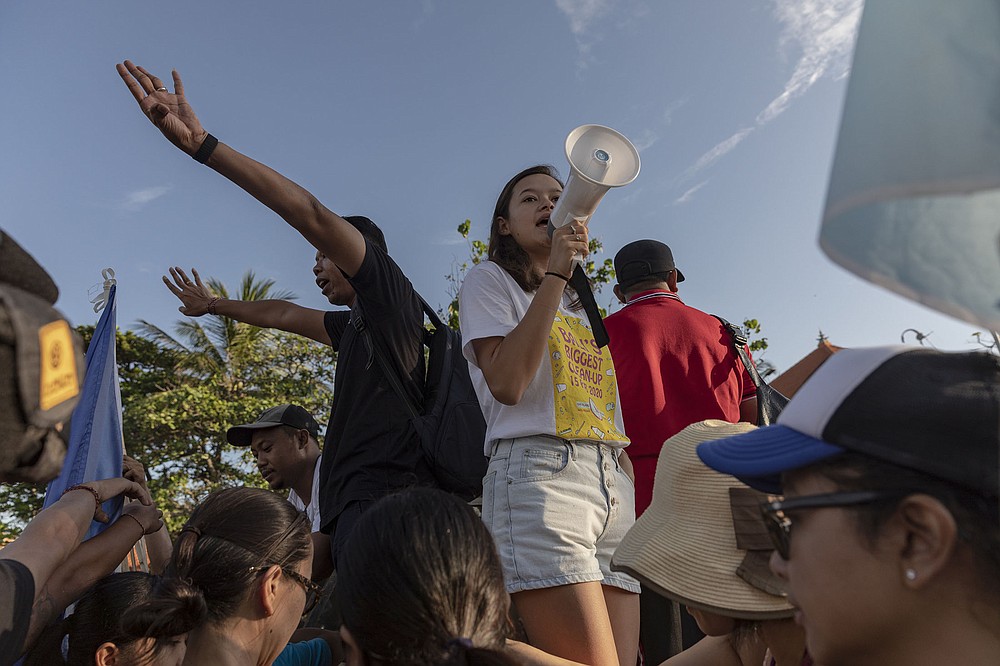 Melati Wijsen, founder along with her sister Isabel of Bye Bye Plastic Bags, uses a megaphone while organizing volunteers for Bali’s Biggest Clean Up, at Petitenget Beach in Bali, Indonesia, Feb. 15, 2020. Since starting their campaign to reduce Bali’s plastic waste, the teenage sisters have traveled around the world to speak at major events.
(The New York Times/Nyimas Laula)