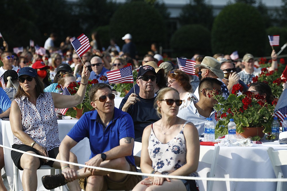 Guests wait for a "Salute to America" event to start and President Donald Trump and first lady Melania Trump on the South Lawn of the White House, Saturday, July 4, 2020, in Washington. (AP Photo/Patrick Semansky)