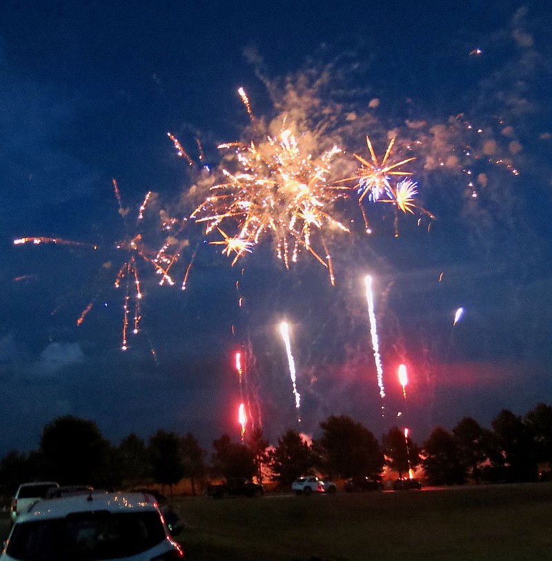 Westside Eagle Observer/SUSAN HOLLAND
Multiple projectiles shoot skyward, providing a dazzling display of light and color to open the Gravette fireworks show Friday evening, July 3. Many area residents and visitors gathered to watch the show at Gravette High School.