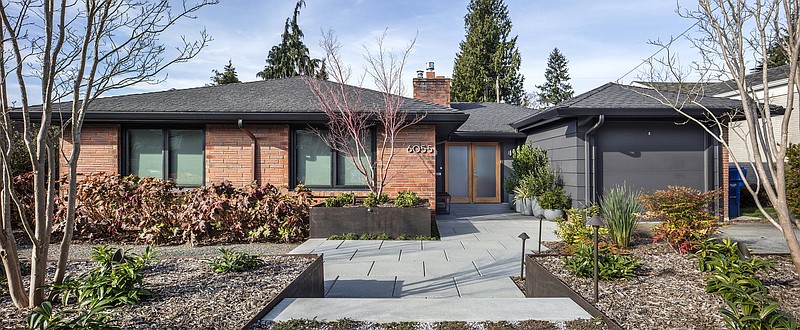 Before the remodel of Sachin and Annas 1948 Hawthorne Hills home, says architect Julie Campbell of CTA Design Builders, "The garage was most prominent, with just grass and bushes. They turned it into a patio space with the intention to use it as a front-yard living room."
(TNS/The Seattle Times/Steve Ringman/)