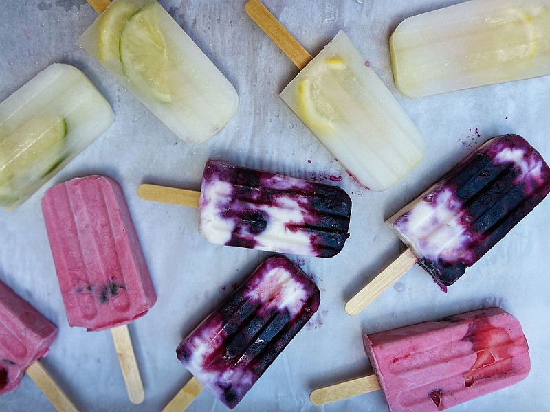 Use purees of fruit, cream, yogurt or simply juice and herbs to make these pretty homemade popsicles.  (The Philadelphia Inquirer/TNS/Jamila Robinson)