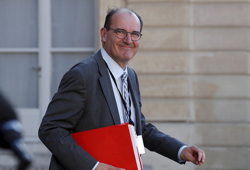 FILE - In this May 19, 2020 file photo, French government coordinator for the end of lockdown Jean Castex leaves after a videoconference with the French President and French mayors at the Elysee Palace in Paris. French President Emmanuel Macron has named Jean Castex, who coordinated France's virus reopening strategy, as new prime minister on Friday July 3, 2020. Emmanuel Macron is reshuffling the government to focus on reviving the economy after months of lockdown. (Gonzalo Fuentes/Pool via AP, File)