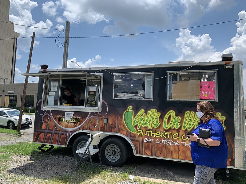 The Grills on Wheels food truck parks on a lot next to Frances Flowers on Capitol Avenue in Little Rock. The owners are moving into a brick-and-mortar restaurant, to be called Wicked Taco Factory, on Second Street.
(Arkansas Democrat-Gazette/Eric E. Harrison)