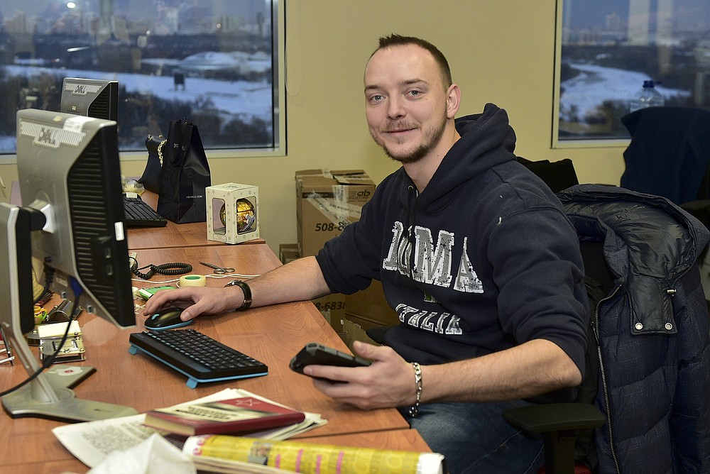 ADDING RUSSIA OUT - In this photo taken on Sunday, Jan. 10, 2016, Ivan Safronov looks at a photographer in his working place in Kommersant Publishing House in Moscow, Russia. Safronov, an adviser to the director of Russia's state space corporation Roscosmos, has been detained on treason charges by the nation's top security agency. (Peter Kassin, Kommersant Photo via AP)