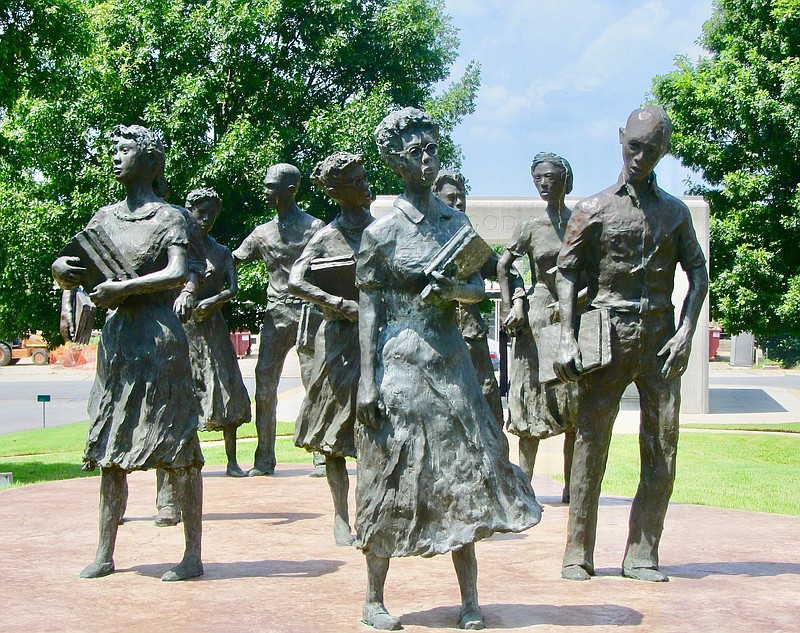 The Little Rock Nine are depicted in a sculpture by John and Cathy Deering outside the state Capitol.