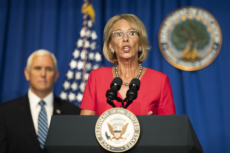 Education Secretary Betsy DeVos, with Vice President Mike Pence, speaks during a White House Coronavirus Task Force briefing at the Department of Education building Wednesday in Washington. - AP Photo/Manuel Balce Ceneta