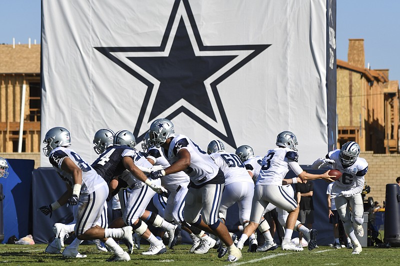 Dallas Cowboys practice on July 29, 2019, at the NFL team’s training camp in Oxnard, Calif. The coronavirus pandemic forced the NFL to abandon, at least for 2020, the fading but still time-honored tradition of teams traveling to training camp. - Photo by Michael Owen Baker of The Associated Press