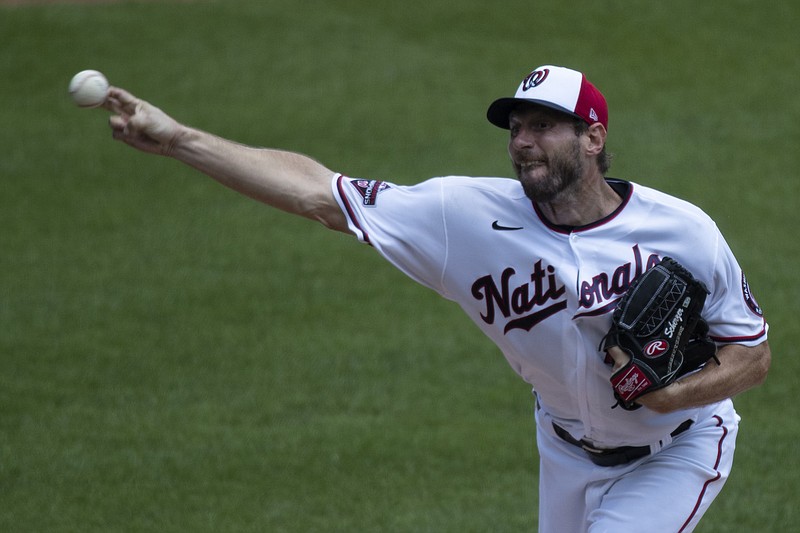 Washington Nationals starting pitcher Max Scherzer throws during a baseball training camp workout at Nationals Park, Wednesday, July 8, 2020, in Washington. (AP Photo/Alex Brandon)