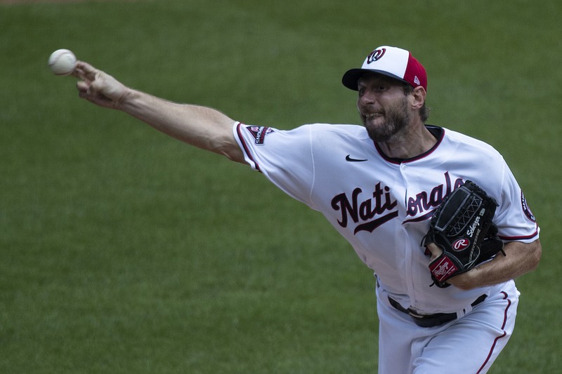 Washington Nationals starting pitcher Max Scherzer throws during a training camp workout at Nationals Park Wednesday in Washington. - Photo by Alex Brandon of The Associated Press