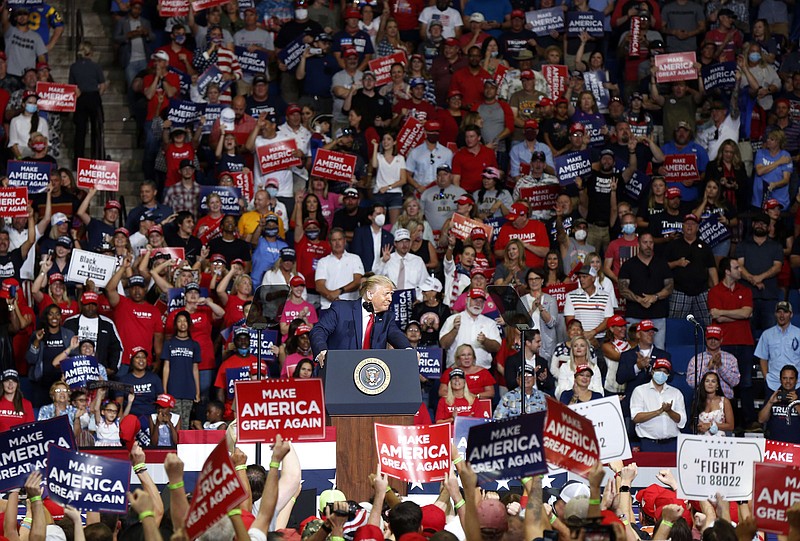 FILE - In this Saturday, June 20, 2020, file photo, President Donald Trump speaks at BOK Center during his rally in Tulsa, Okla. The head of the Tulsa-County Health Department says Trump’s campaign rally in late June “likely contributed” to a dramatic surge in new coronavirus cases there. (Stephen Pingry/Tulsa World via AP, File)