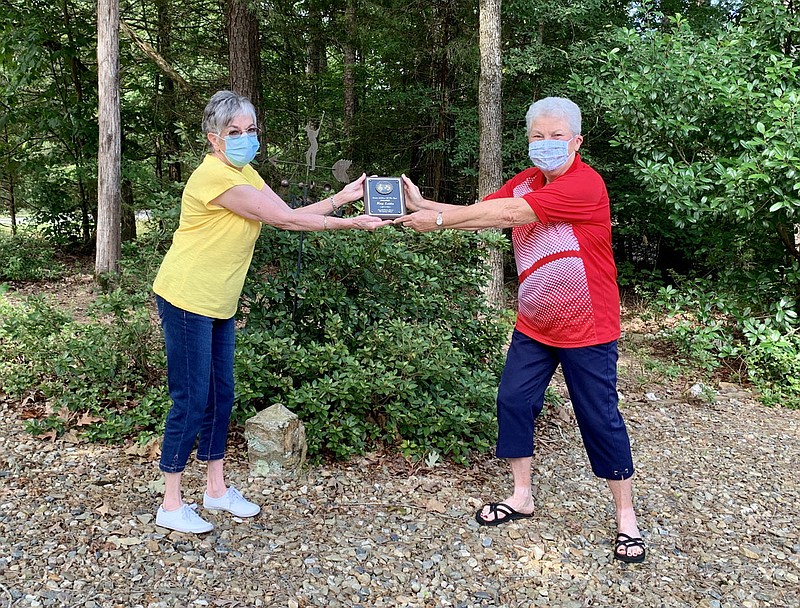 Becky Denny, left, the Crystal Chimes Chorus’ 2018-19 Sweet Adeline of the Year, presents the 2019-20 award to Kay Latta. - Submitted photo