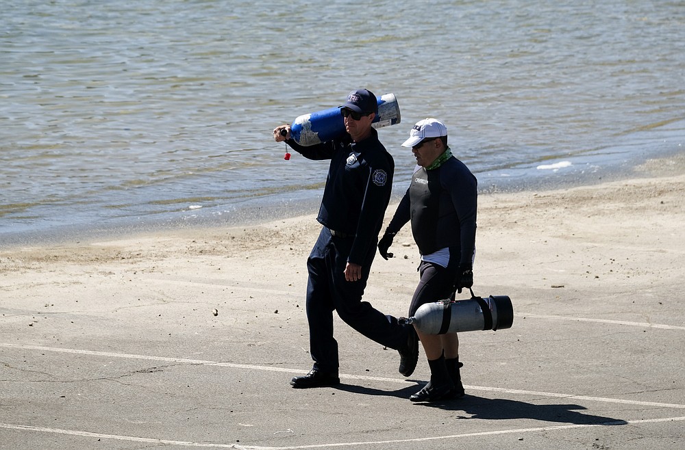 Members of Ventura County Sheriff's Office Underwater Search and Rescue Team arrive, Thursday, July 9, 2020 in Lake Peru, Calif., to search for missing "Glee" actress Naya Rivera. Rivera rented a boat on Wednesday and her 4-year-old son was found alone on the rented boat. (AP Photo/Ringo H.W. Chiu)