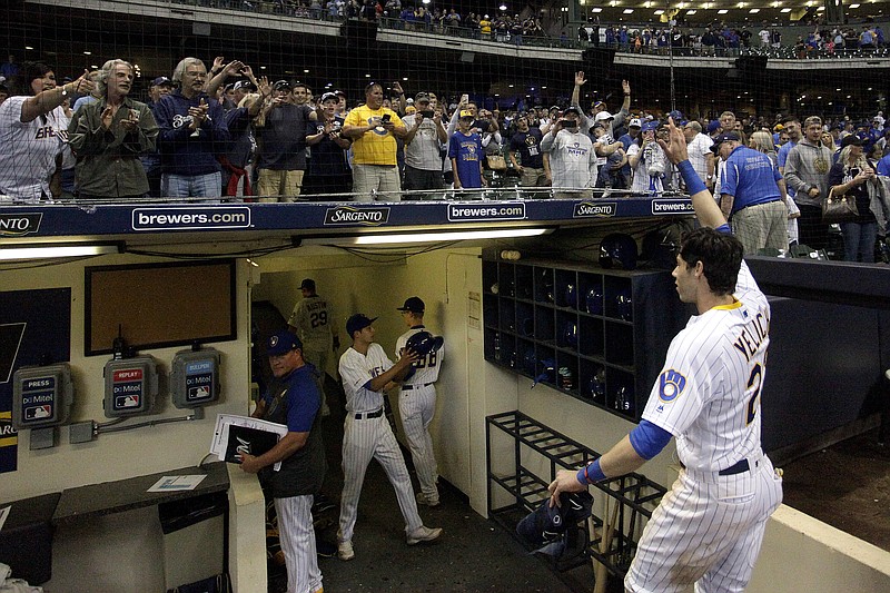 Fans cheer as Milwaukee Brewers' Christian Yelich walks off the field after driving in the winning run with a double during the ninth inning of the team's Sept. 7, 2019, baseball game against the Chicago Cubs in Milwaukee. Major League Baseball will start each extra inning this season by putting a runner on second base. This rule has been used since 2018 in the minor leagues, where it created more action and settled games sooner. “I think it’s great,” Yelich said. “As a player, there’s nothing worse than extra innings." - Photo by Aaron Gash of The Associated Press