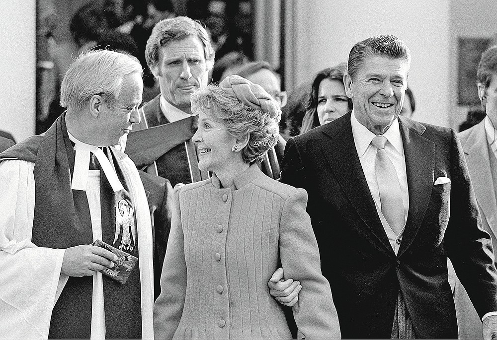 FILE - In this January 1981 file photo, President-elect Ronald Reagan and his wife, first lady Nancy, leave St. John's Church in Washington, after attending services. The Greek Revival house of worship was consecrated in 1816 and often dubbed “the Church of the Presidents” for having hosted every leader since James Madison for at least one service. (AP Photo)