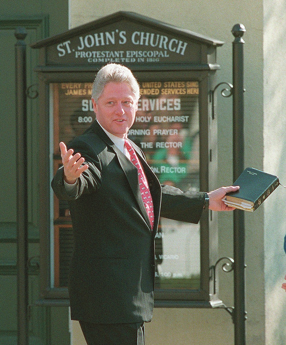 FILE - In this Sunday, March 24, 1996 file photo, President Bill Clinton leaves St. John's Church after attending services in Washington. Clinton attended without first lady Hillary Rodham Clinton, who opened an eight-day goodwill tour through Europe Sunday. (AP Photo/Ron Edmonds)