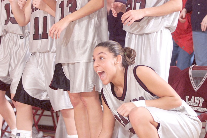 Arkansas Democrat-Gazette File Photo
India Lewis cheers on her Siloam Springs teammates near the end of a 1999 game against Harrison.