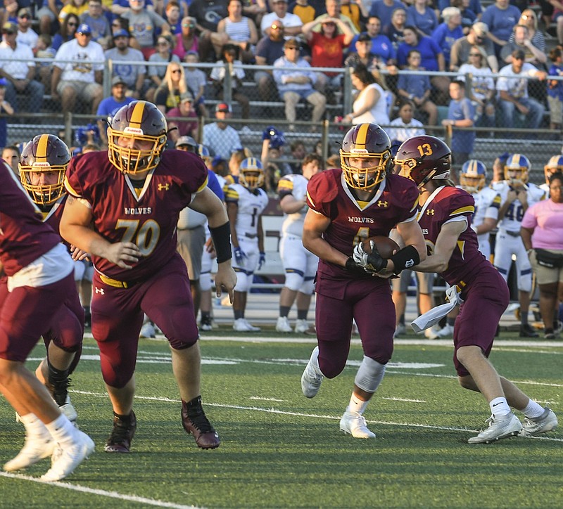 Lake Hamilton’s Owen Miller (4), right, runs the ball during a game against Lakeside on Sept. 5, 2019. The high school football season could see adjustments in the coming weeks. - Photo by Grace Brown of The Sentinel-Record